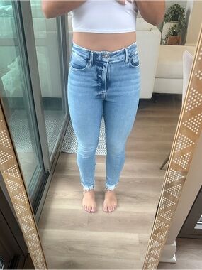 Good American Light Blue Skinny Jeans with Distressed Hem